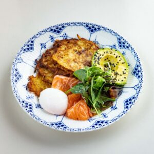 Draniki with salmon and poached egg