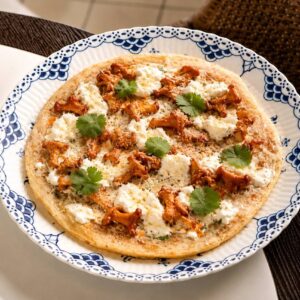 Roti flatbread with marinated chanterelles and stracciatella